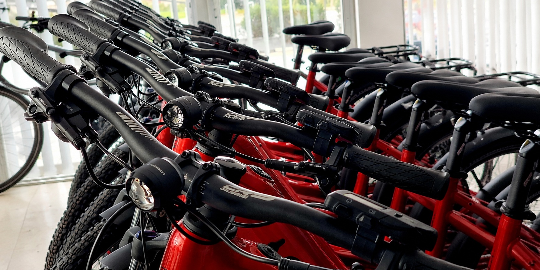 Close-up of electric bikes prepared at BiRide Dimokratias 19 Branch in Paphos for rental, delivery and fleet support
