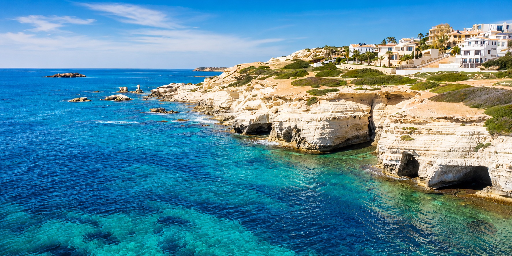 Sea Caves in Paphos, Cyprus, with white limestone cliffs and turquoise water on the BiRide e-bike coastal route